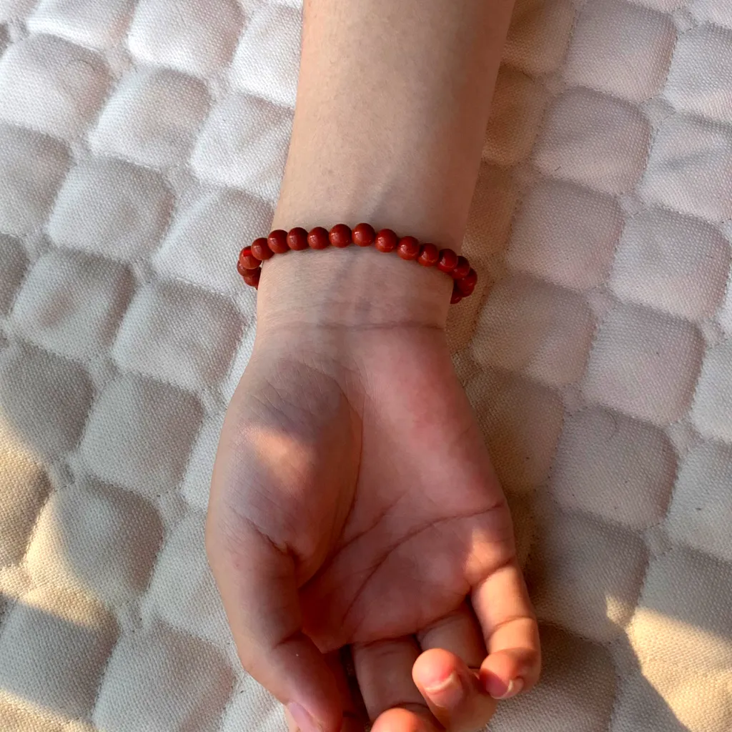 Red Jasper Bracelet worn on the wrist