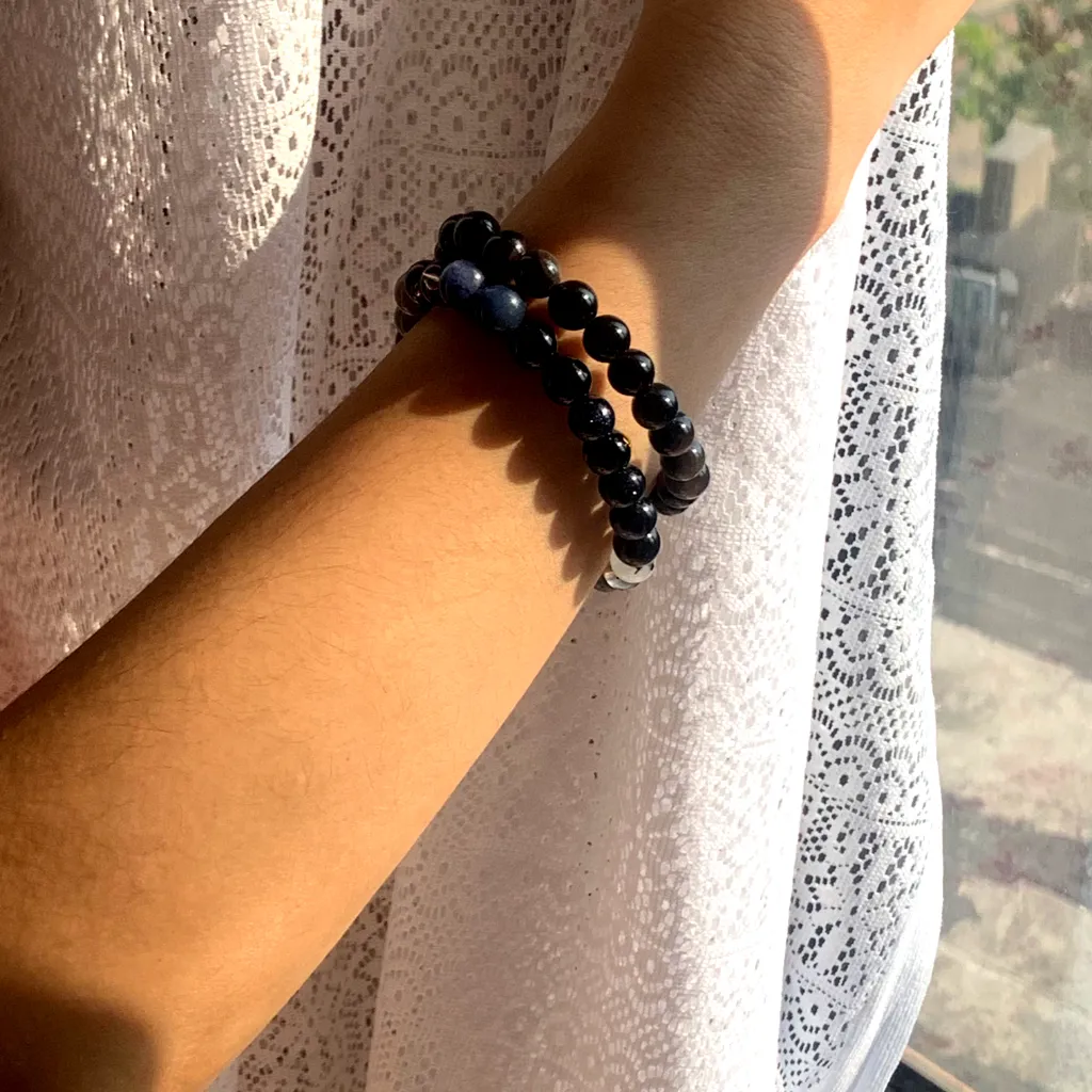 Water Element Bracelet layered with Silver Sheen Obsidian Bracelet on the wrist — a stacked everyday styling