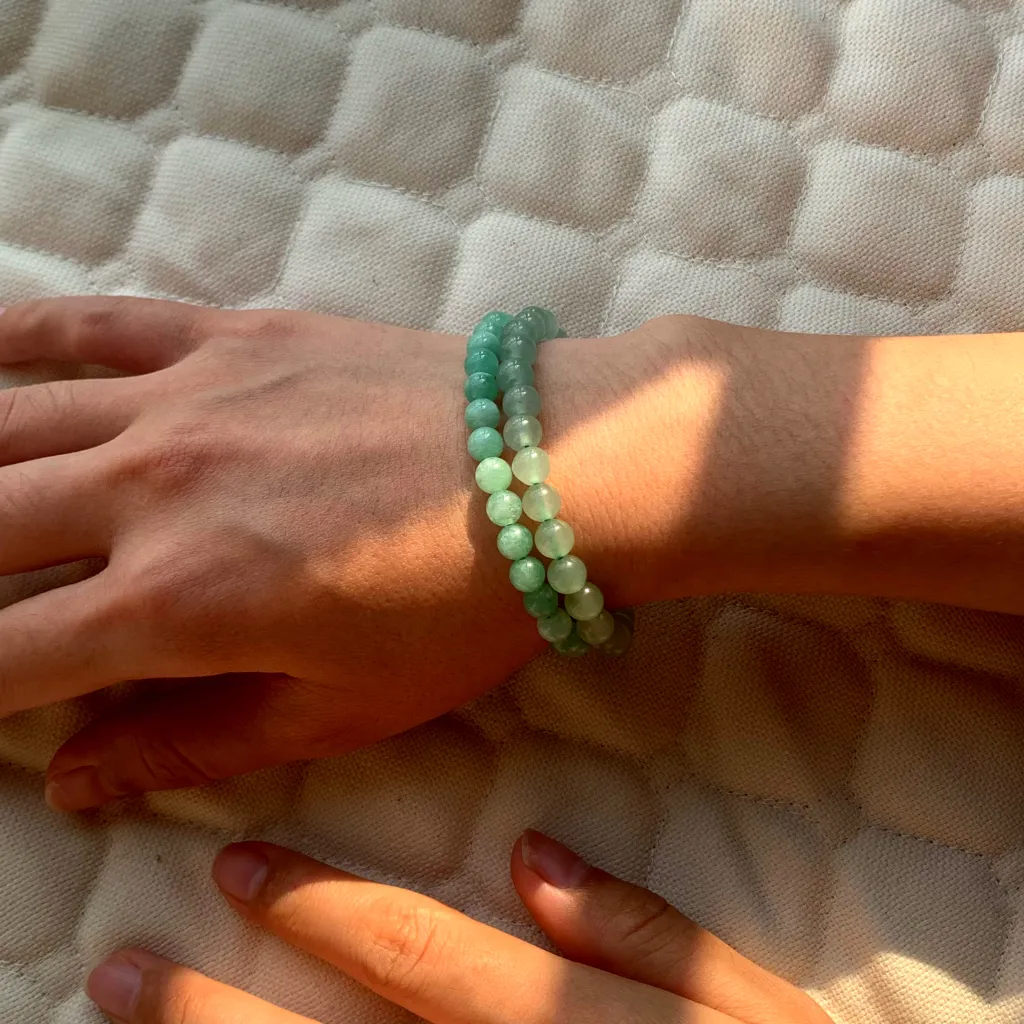 Green Aventurine Bracelet layered with Burmese Jade Bracelet on the wrist — a stacked everyday styling