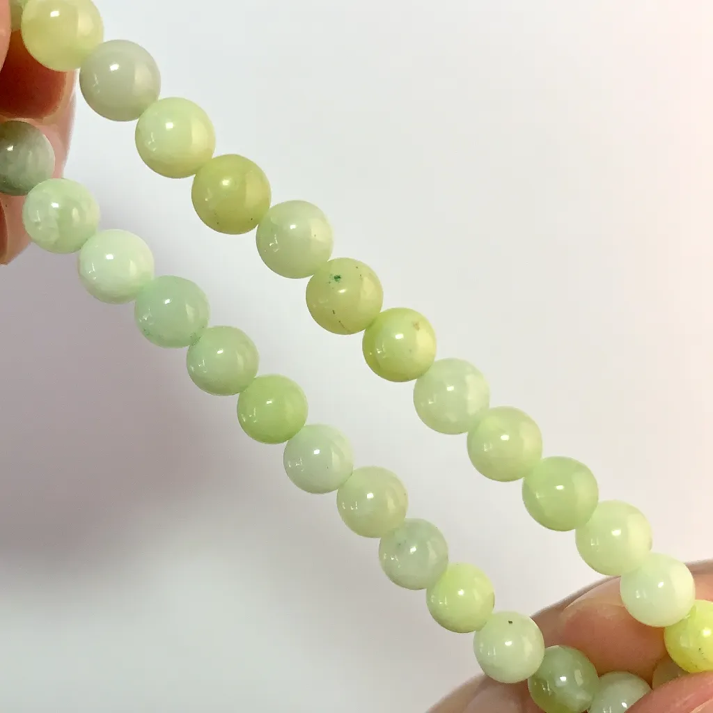 Close-up of New Mountain Jade beads and elastic cord
